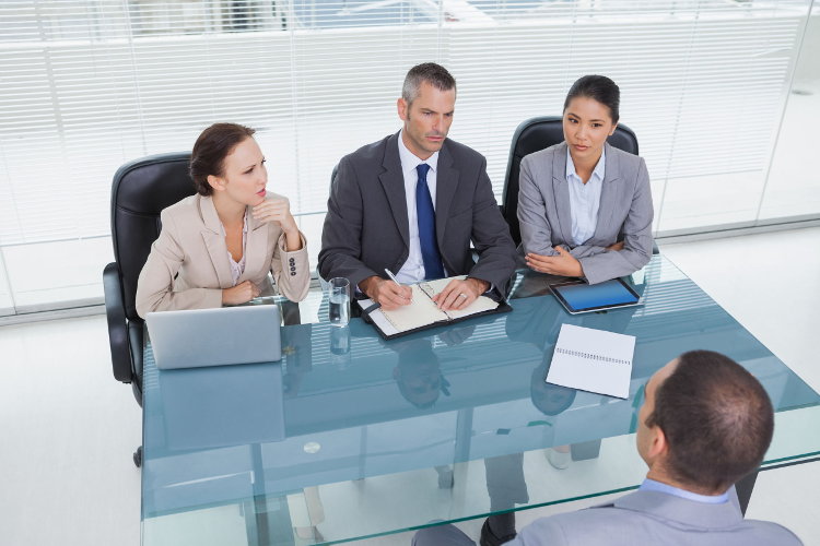 Interviewers listening to candidate